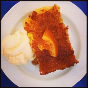 A slice of portokalopita (orange pie) served with vanilla ice-cream, at Kallisto in Hora, Amorgos