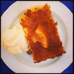 A slice of portokalopita (orange pie) served with vanilla ice-cream, at Kallisto in Hora, on the Greek island of Amorgos