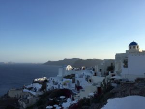 White-washed houses and blue-domes churches in Oia, Santorini