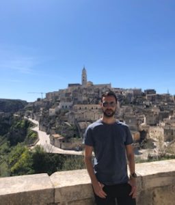 The author against a backdrop of the cave dwellings and the Duomo