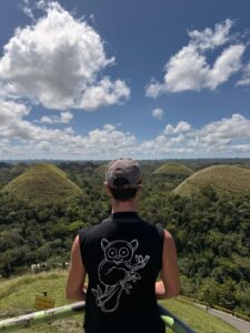 Looking at the Chocolate Hills in Bohol with the Philippine tarsier on my back
