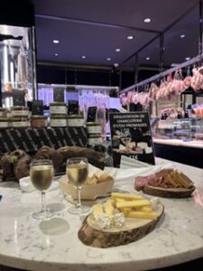 For a relaxed wine-and-cheese experience, I’d recommend Cellelier at Les Halles Paul Bocuse